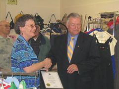 Debbie MacDonald Moynes accepts a certificate from Mayor Leo Finnegan