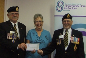 President of Legion Branch 78 presents a cheque for $1500.00 to Barbara Lyons